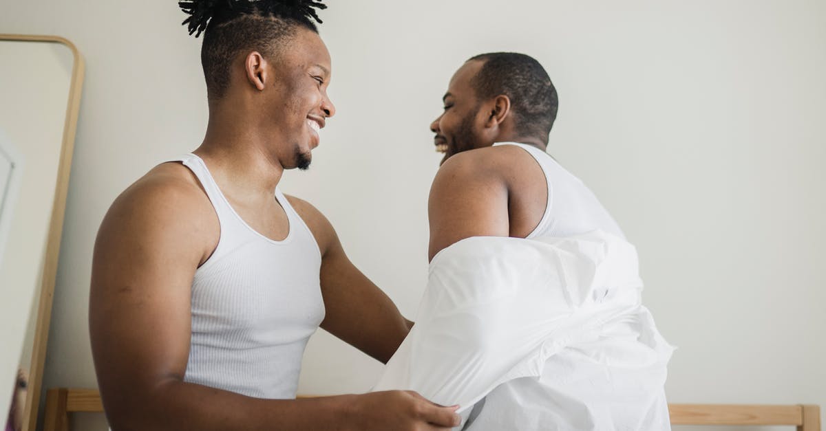 How to turn off news/achievements of other players - Man Taking Off Shirt from Other Man in Bedroom