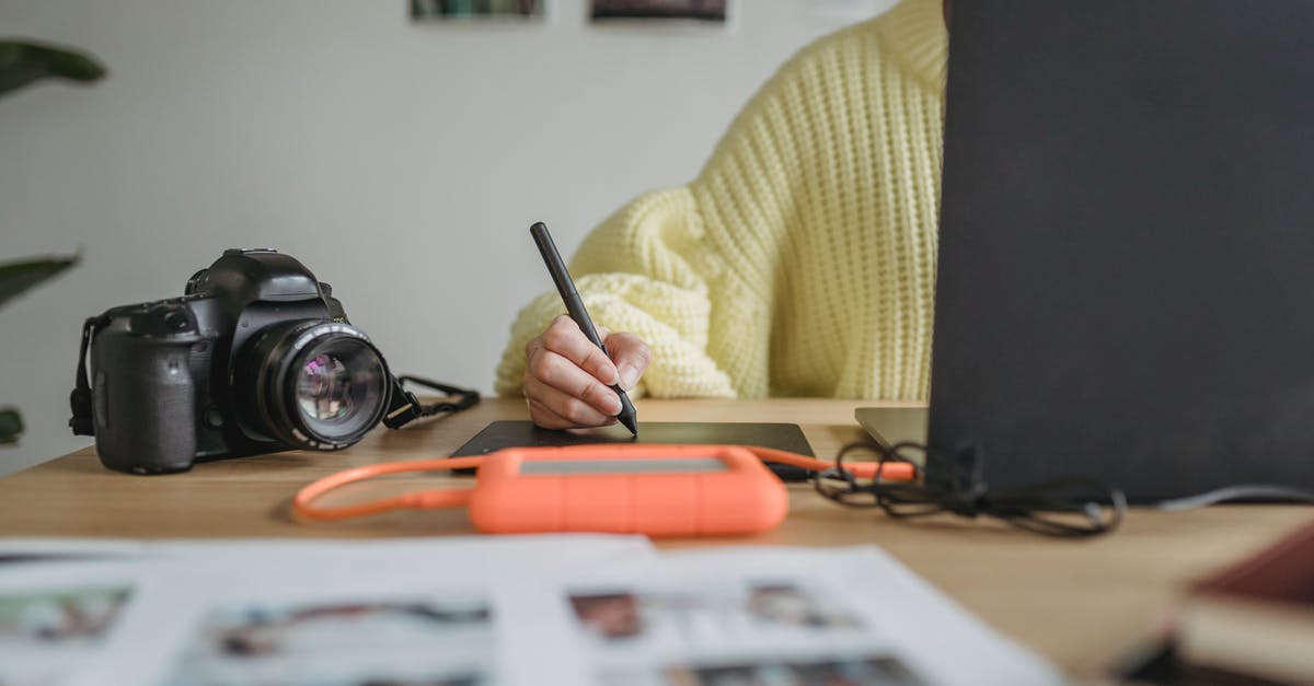 How to understand which creature is the best to be mimicked using Phantom Image or Create Illusion in Heroes IV? - Crop anonymous woman using graphic tablet while editing photos on netbook at table with photo camera and blurred printed photos