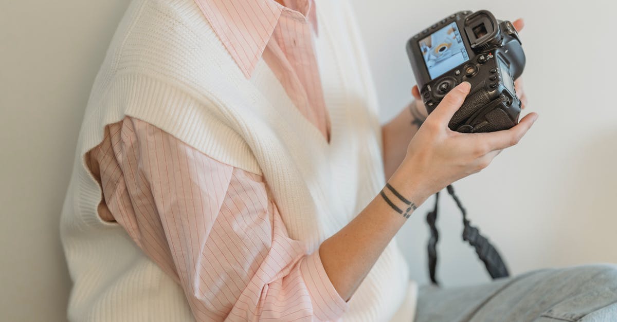 How to understand which creature is the best to be mimicked using Phantom Image or Create Illusion in Heroes IV? - Crop anonymous female photographer wearing casual clothes looking through pictures in professional photo camera against white wall in light room