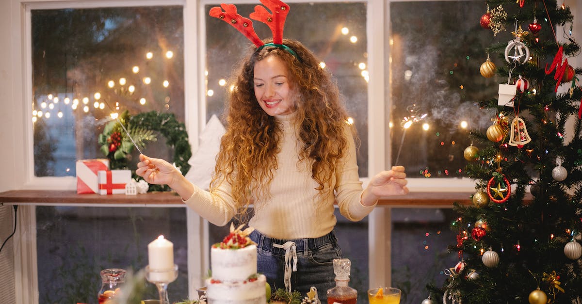 How to unlock content in Magic Origins - Cheerful female in decorative deer horns with burning sparklers standing at table with tasty cake for New Year holiday at home How to unlock content in Magic Origins - Cheerful female in decorative deer horns with burning sparklers standing at table with tasty cake for New Year holiday at home