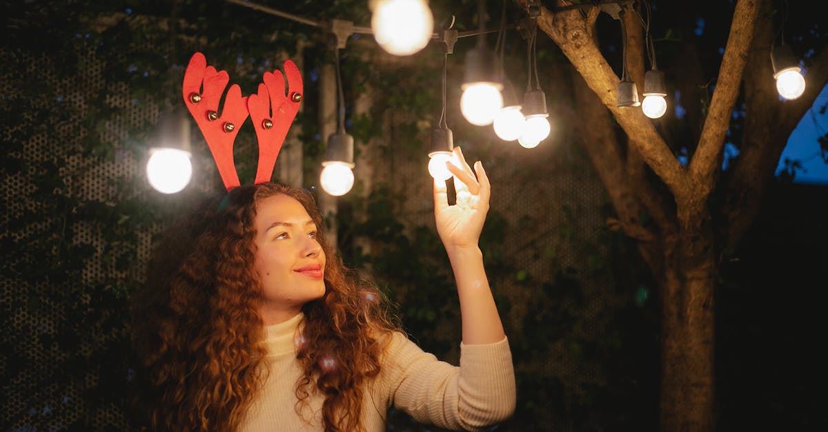 How to unlock content in Magic Origins - Pondering woman touching shiny garland during Christmas holiday outdoors How to unlock content in Magic Origins - Pondering woman touching shiny garland during Christmas holiday outdoors