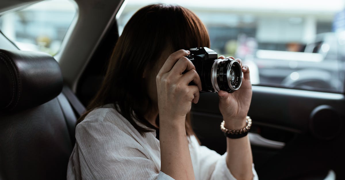 How to unlock the "Madness" Digital Trip car in singleplayer/free roam? - Unrecognizable female traveler taking photo on photo camera in automobile