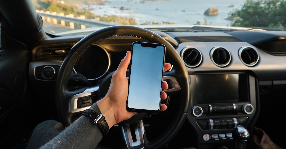 How to unlock the "Madness" Digital Trip car in singleplayer/free roam? - Crop anonymous guy with tattoo on hand navigating on mobile phone while driving car near sea How to unlock the "Madness" Digital Trip car in singleplayer/free roam? - Crop anonymous guy with tattoo on hand navigating on mobile phone while driving car near sea