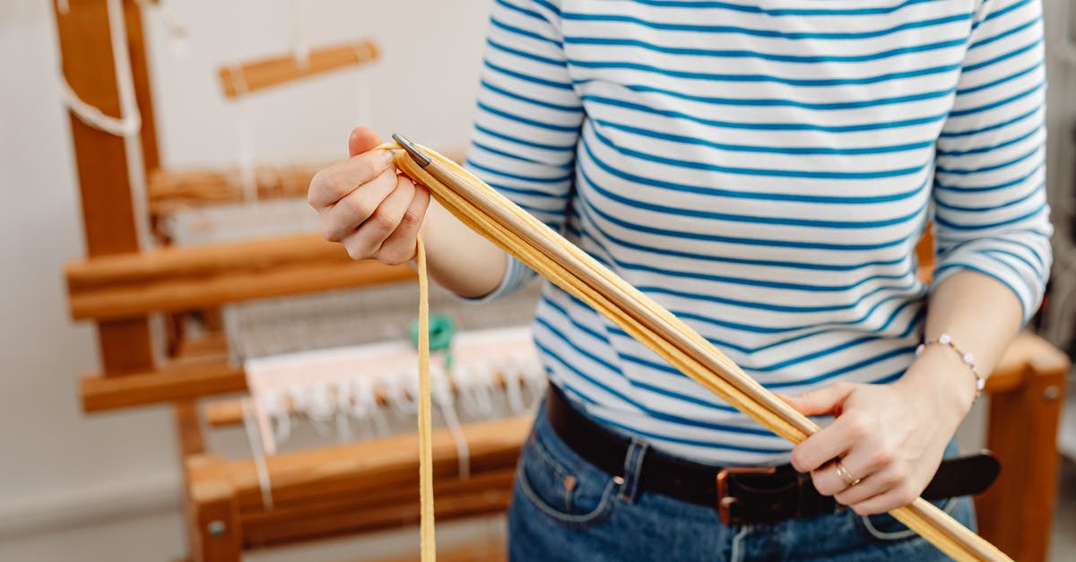 How to upload a mod to Steam Workshop - Close-up a Woman Holding a Weave and a Stick