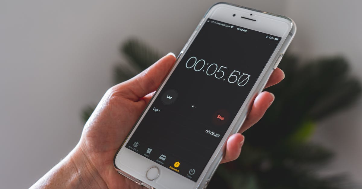 How to use a switch to turn a timer on without the timer turning itself off? - Person Holding Silver Iphone 6