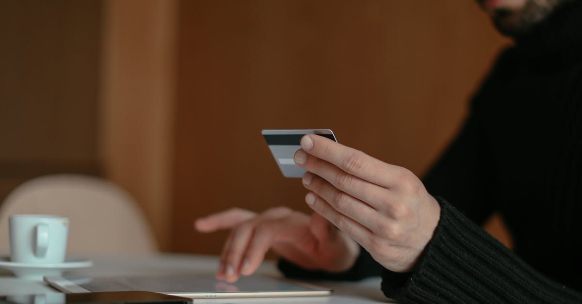 how to use IGI-4 cheats [closed] - Close up of a Man Using a Bank Card Online