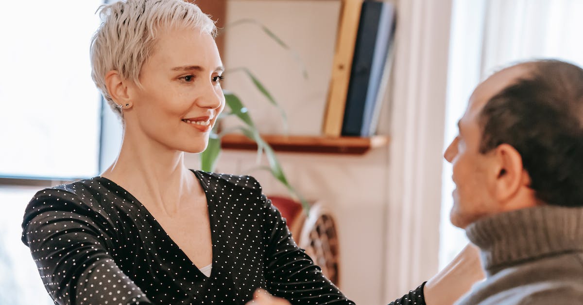 How to use Tall Goat and other rewards? - Smiling woman looking at man while dancing