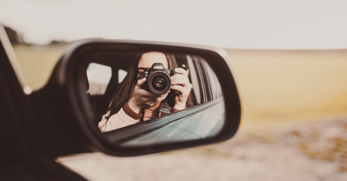 How to use /testfor command on a specific location 1.9 [duplicate] - Unrecognizable female photographer taking photos and reflecting in rear window