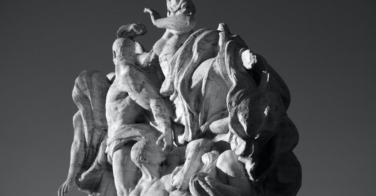 How to view regular tribute of our faction to/from another one in Rome Total War? - From below of black and white allegorical marble sculpture located on Ponte Vittorio Emanuele II bridge on sunny day in Rome