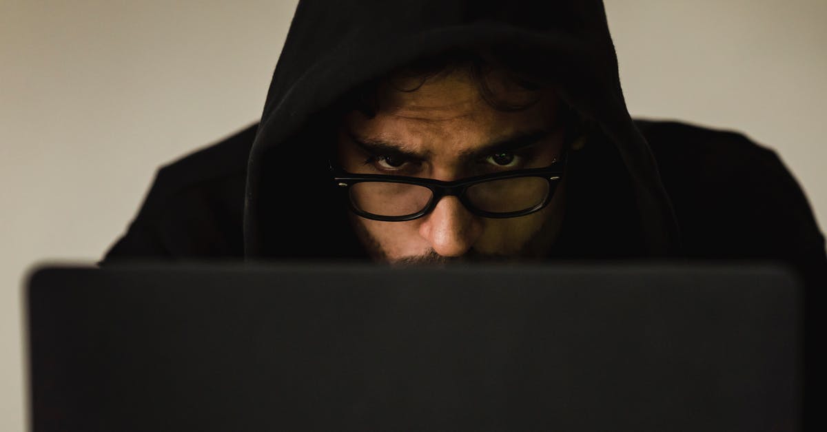 How useful are hacker arrays? - Serious young male programmer wearing black hoodie browsing netbook and hacking software in studio How useful are hacker arrays? - Serious young male programmer wearing black hoodie browsing netbook and hacking software in studio
