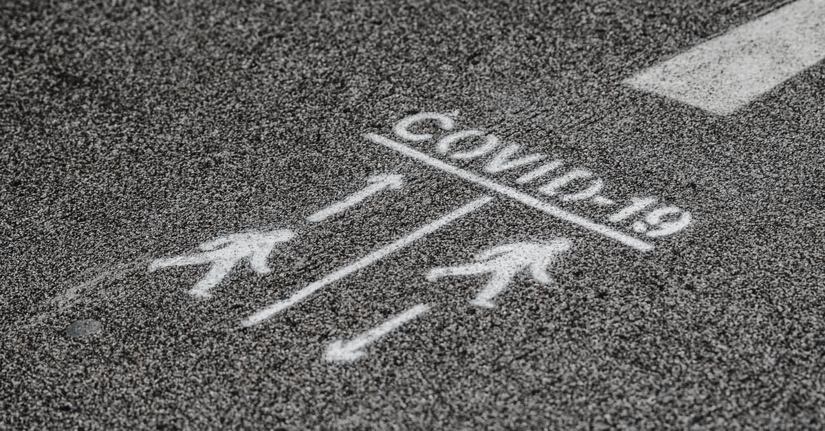 How would I be able to keep a mob a certain distance away in a specific direction from the player? - From above COVID 19 warning inscription about social distance on asphalt pavement on street