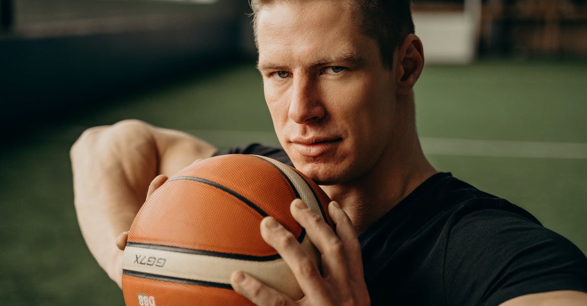 How would I make a player take damage when they're looking at another player - A Man in Black Shirt Holding a Ball How would I make a player take damage when they're looking at another player - A Man in Black Shirt Holding a Ball