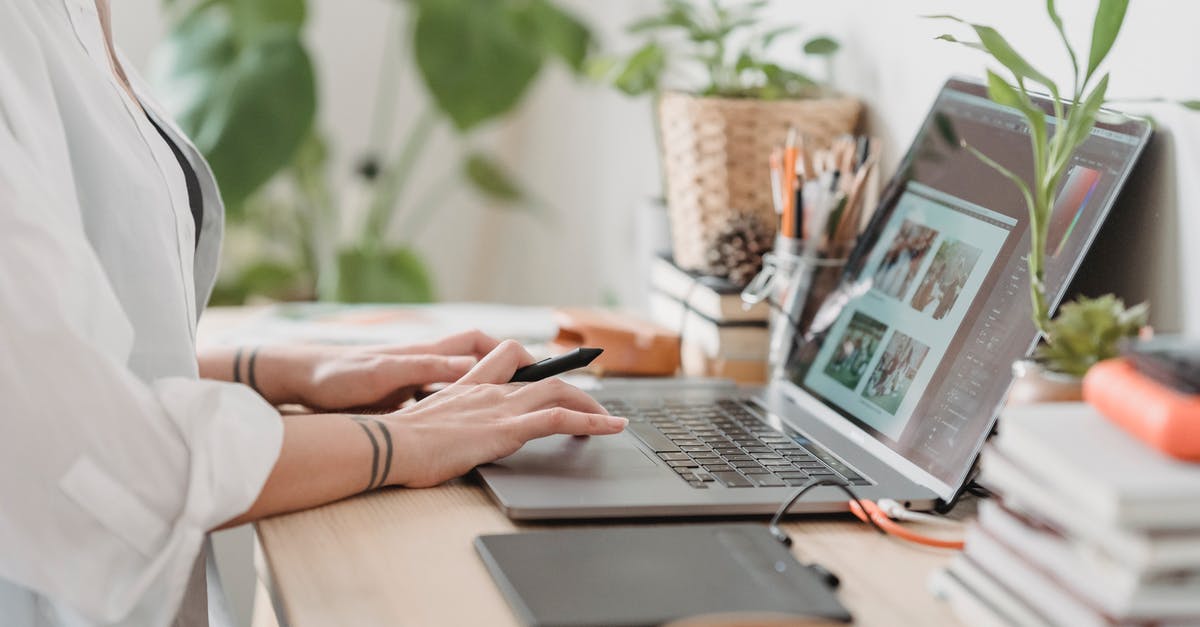 HTC Vive display is blurry - Woman working retouching photo on laptop at convenient workplace HTC Vive display is blurry - Woman working retouching photo on laptop at convenient workplace