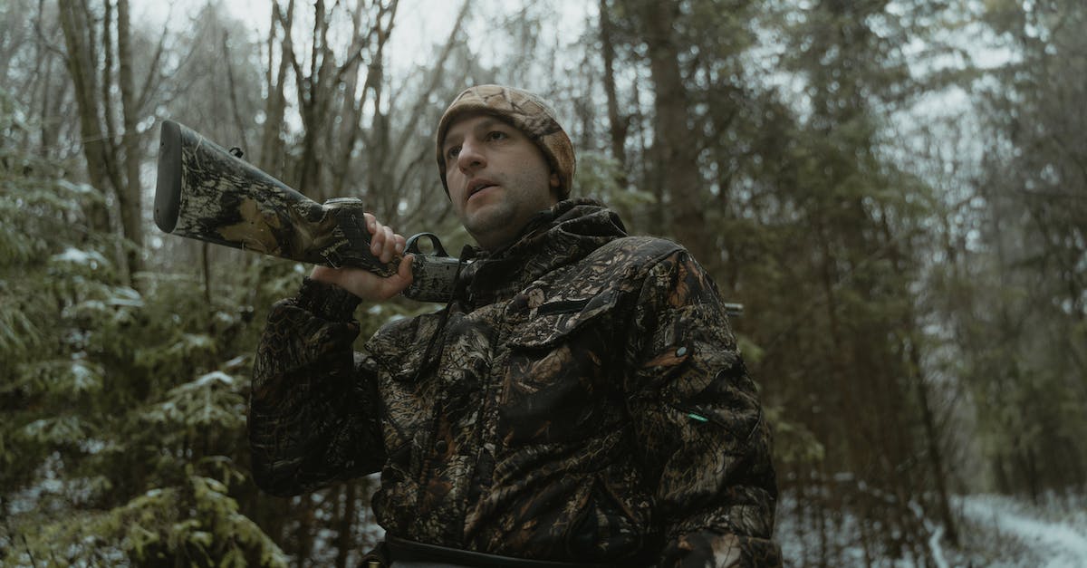 Hunting or normal spears for hunting low level creatures - Low-Angle Shot of a Man Holding a Firearm Hunting or normal spears for hunting low level creatures - Low-Angle Shot of a Man Holding a Firearm