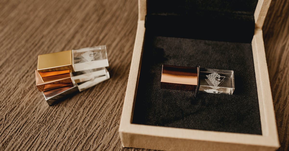 I accidently removed my Xbox 360's USB - High angle of pile of modern pen drives against wooden box for gift on rough surface