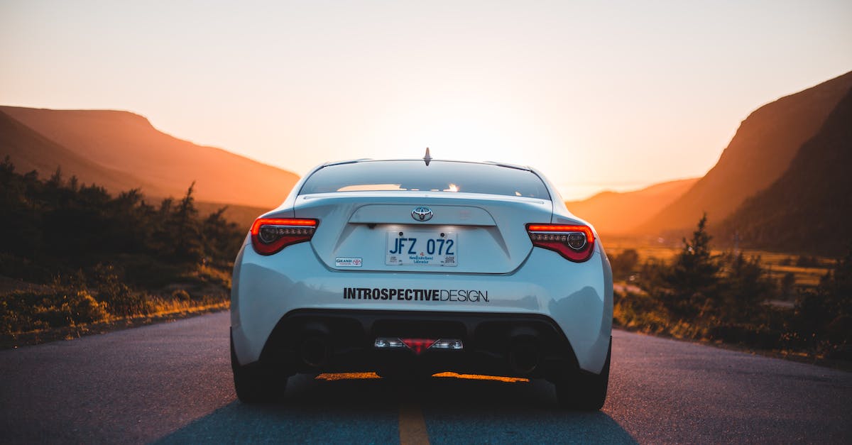 I alt tabbed out of Skyrim and there's no way to tab back in [duplicate] - Back part of modern white automobile on paved highway road in mountains glowing with sunset light