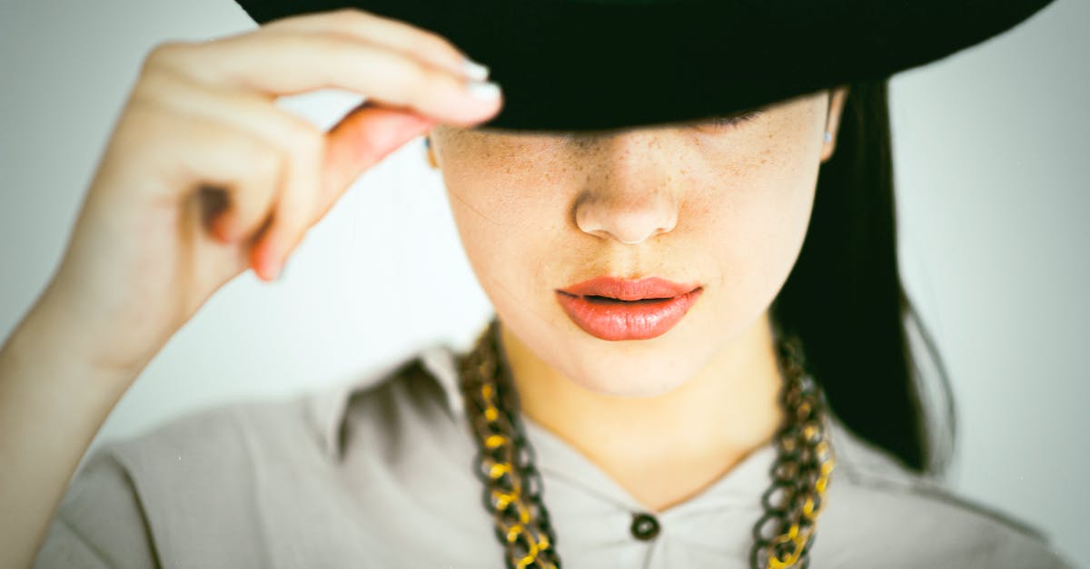 I can't change my skin because there is no button that says custom skins [duplicate] - Crop stylish woman in hat and necklace on white background