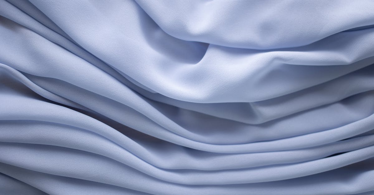 I can't clear dyes - Closeup of textured background of crumpled light blue dyed textile with uneven texture