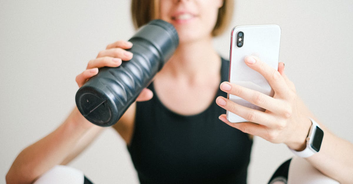 I can't install Eve online for OS X - Photo of Woman Holding White Smartphone and Sports Bottle