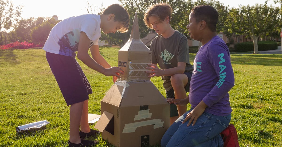 I can't perform science experiments but retrieving space crafts - Man in White Polo Shirt Standing Beside Woman in Purple Dress I can't perform science experiments but retrieving space crafts - Man in White Polo Shirt Standing Beside Woman in Purple Dress