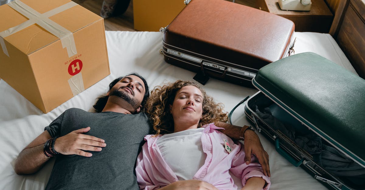 I can't sleep in Minecraft: Pocket Edition? - Sleeping diverse couple lying on bed during relocation in new house