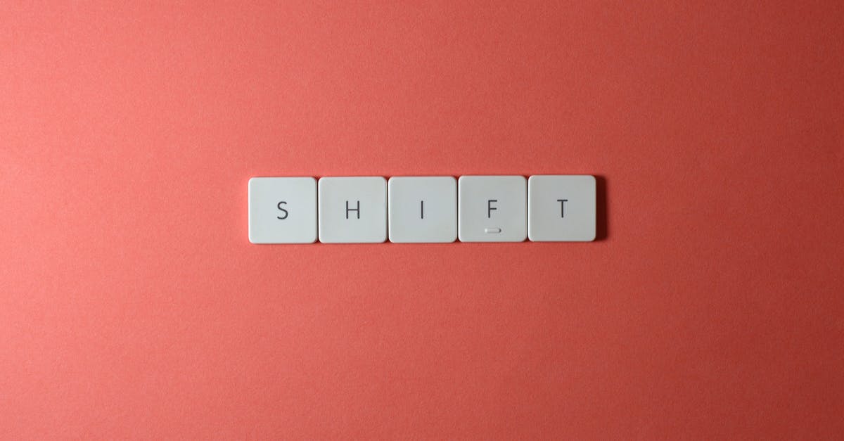 I can't use shift key in dwarf fortress - Close-Up Shot of Keys on a Red Surface I can't use shift key in dwarf fortress - Close-Up Shot of Keys on a Red Surface