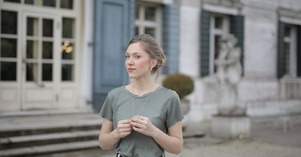 I can't win against my rival - Beautiful young woman standing near old building and looking at camera I can't win against my rival - Beautiful young woman standing near old building and looking at camera