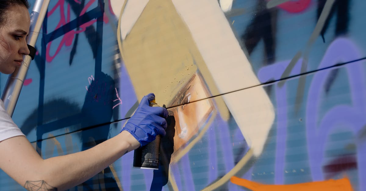 I can only hear my xbox 360 audio not see the picture - Side view of crop focused young female artist painting colorful creative graffiti on wall with spray can on sunny day on city street I can only hear my xbox 360 audio not see the picture - Side view of crop focused young female artist painting colorful creative graffiti on wall with spray can on sunny day on city street