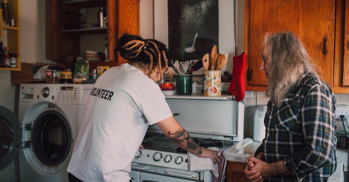 I cant build holding cell kitchen or Canteen help! - A Man Helping an Elderly Man Cleaning his Kitchen