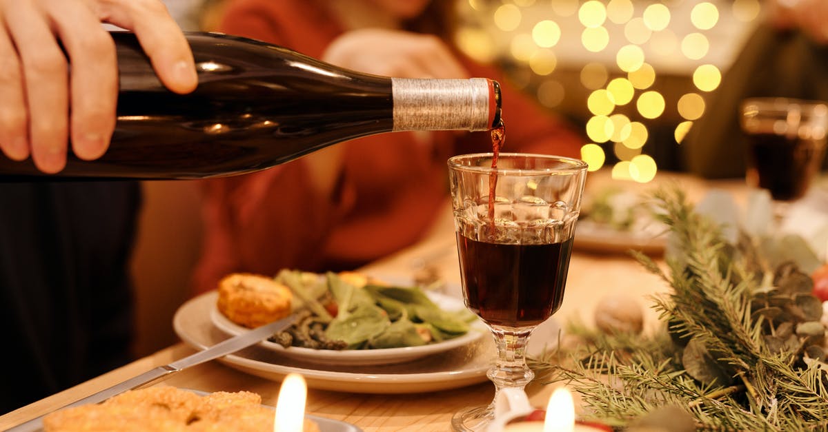 I ended up eating my cat. Can I get a new one? - Person Pouring Wine on Clear Drinking Glass