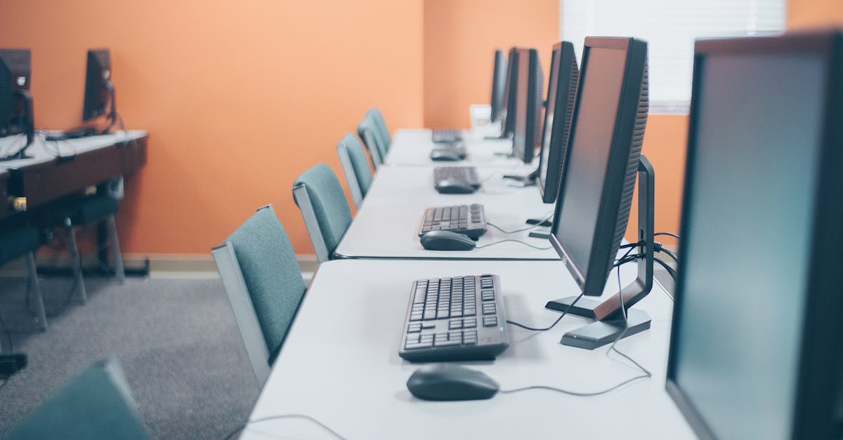 I keep mining when I release the mouse button - Modern office with desktop computers and keyboards I keep mining when I release the mouse button - Modern office with desktop computers and keyboards