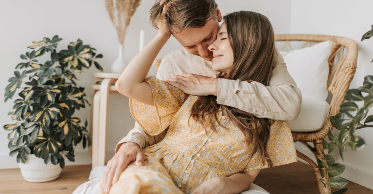 I lost my husband [closed] - Woman in Beige Floral Dress Sitting on White Couch