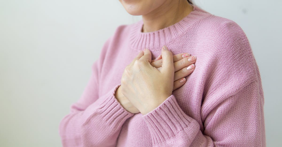 I need help renting a room in Riverwood but the lady is killing me - Content anonymous female wearing warm pink sweater standing on white background with crossed hands on chest in daylight in room I need help renting a room in Riverwood but the lady is killing me - Content anonymous female wearing warm pink sweater standing on white background with crossed hands on chest in daylight in room