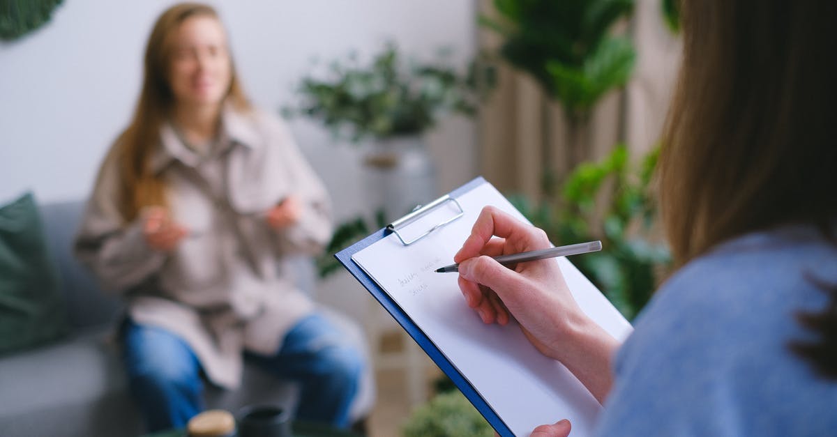 I need some help with this question - Unrecognizable professional female psychologist writing on clipboard while sitting against client on blurred background during psychotherapy session in light office I need some help with this question - Unrecognizable professional female psychologist writing on clipboard while sitting against client on blurred background during psychotherapy session in light office