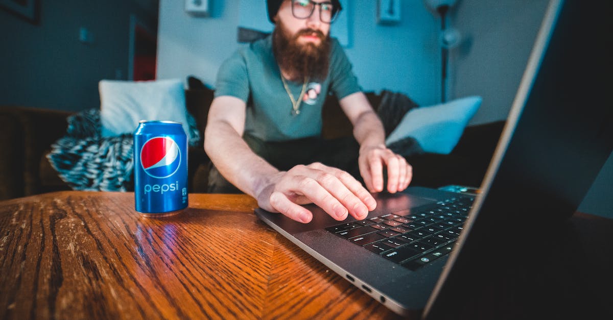 I use an Azerty keyboard. How can I handle keybindings easily? - Man in Blue Polo Shirt Using Black Laptop Computer