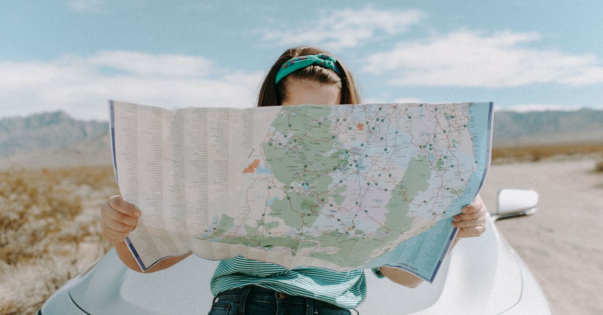 I want a person to pass out on my adventure map but he sees too much - Woman Looking At The Map I want a person to pass out on my adventure map but he sees too much - Woman Looking At The Map
