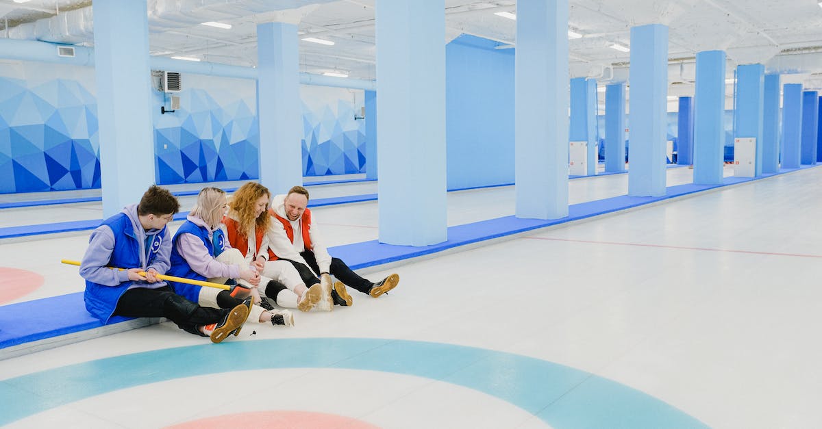 I want to chat with friends, but not hear game sound/volume? - Group of sitting people spending time in curling arena