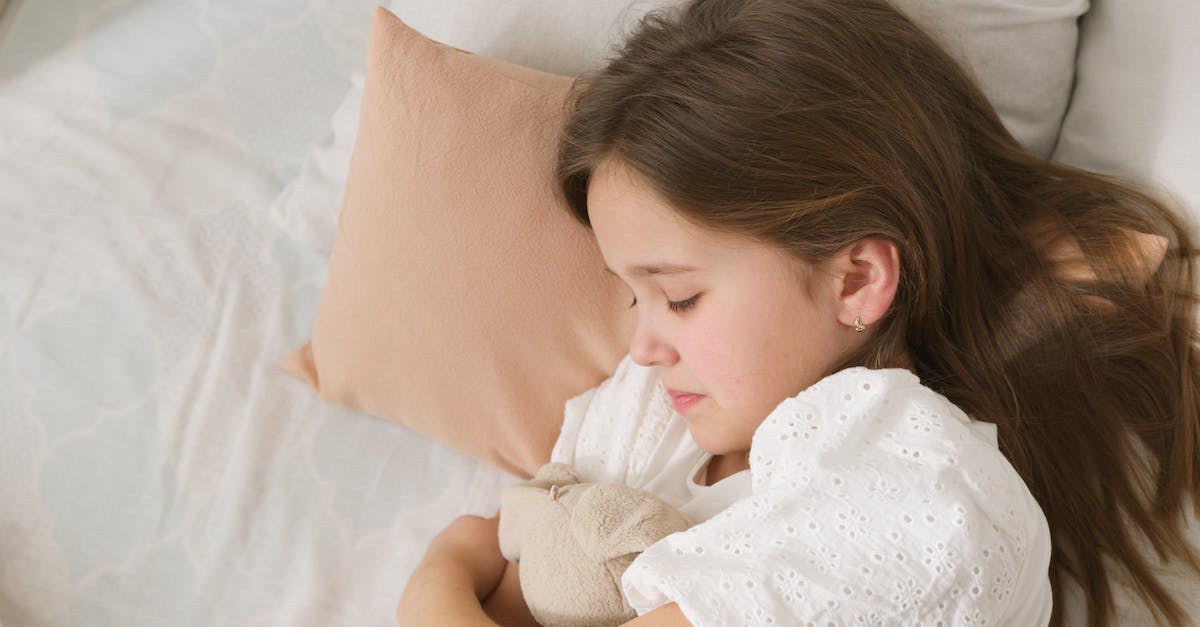 I woke up Cyrus, but he went back to sleep [duplicate] - Girl in White Shirt Lying on Bed