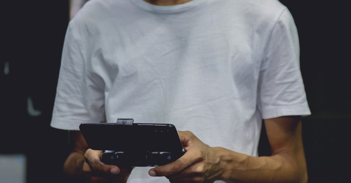 Identify this Android game? - A Smartphone Game Controller On A Person's Hand