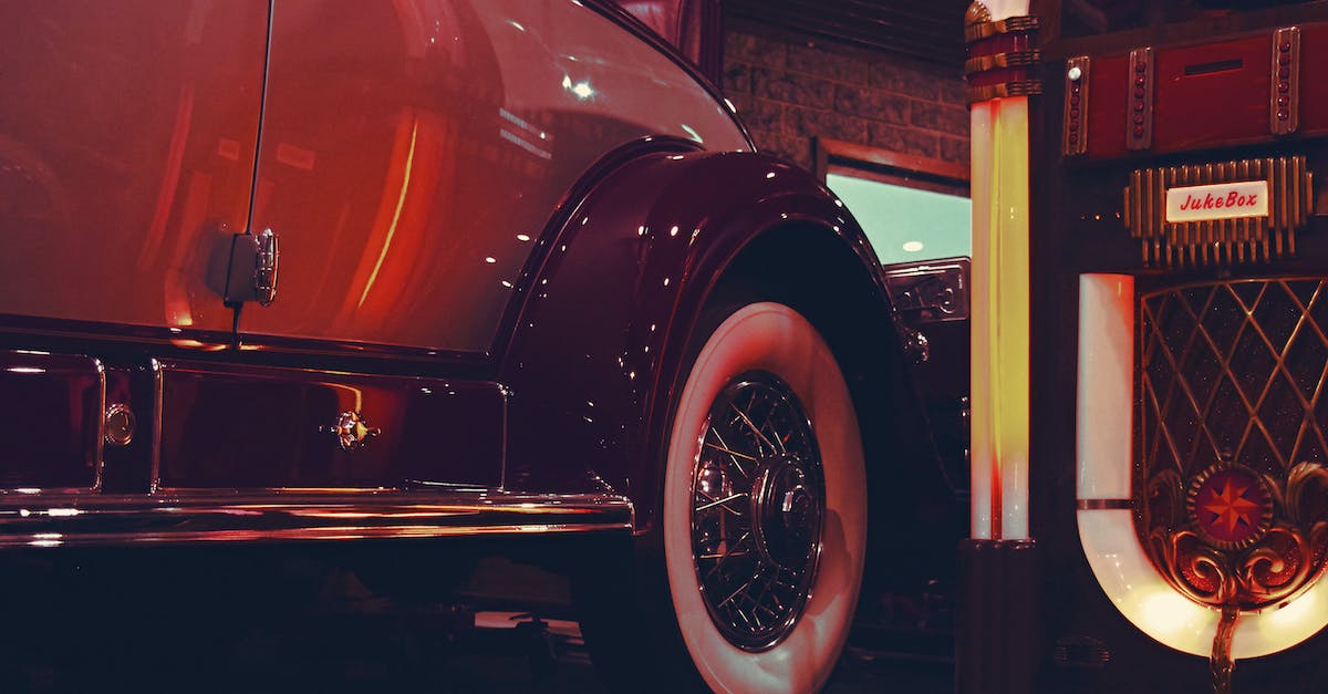 Identify this game: breaking into a museum to restore exhibits, ran on a Mac - Lighted Jukebox Beside White and Brown Car