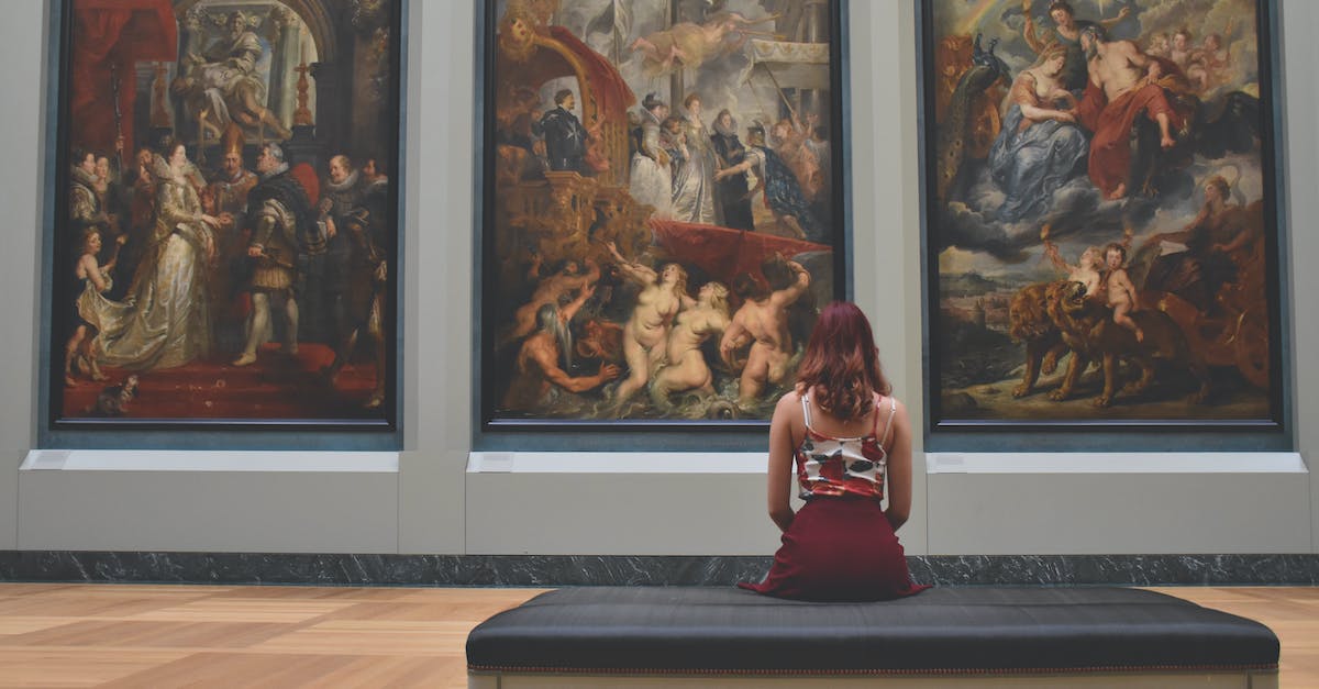 Identify this game: breaking into a museum to restore exhibits, ran on a Mac - Woman Sitting on Ottoman in Front of Three Paintings Identify this game: breaking into a museum to restore exhibits, ran on a Mac - Woman Sitting on Ottoman in Front of Three Paintings