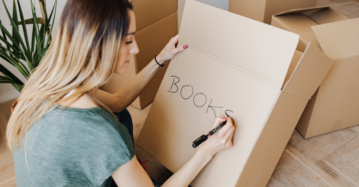 Identify what replacement DVD module to purchase - Content woman writing on cardboard container word book Identify what replacement DVD module to purchase - Content woman writing on cardboard container word book