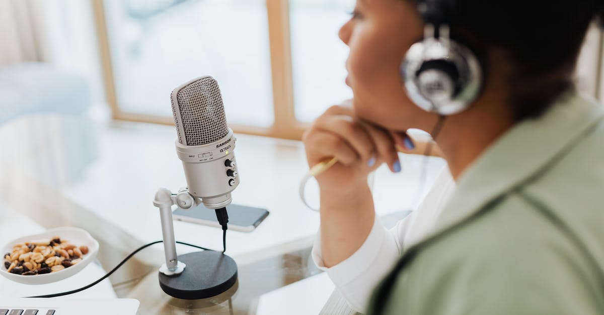 If I plug in headphones with an integrated microphone, will the Wii U use it? - Woman Using Headphones and Microphone with Laptop If I plug in headphones with an integrated microphone, will the Wii U use it? - Woman Using Headphones and Microphone with Laptop