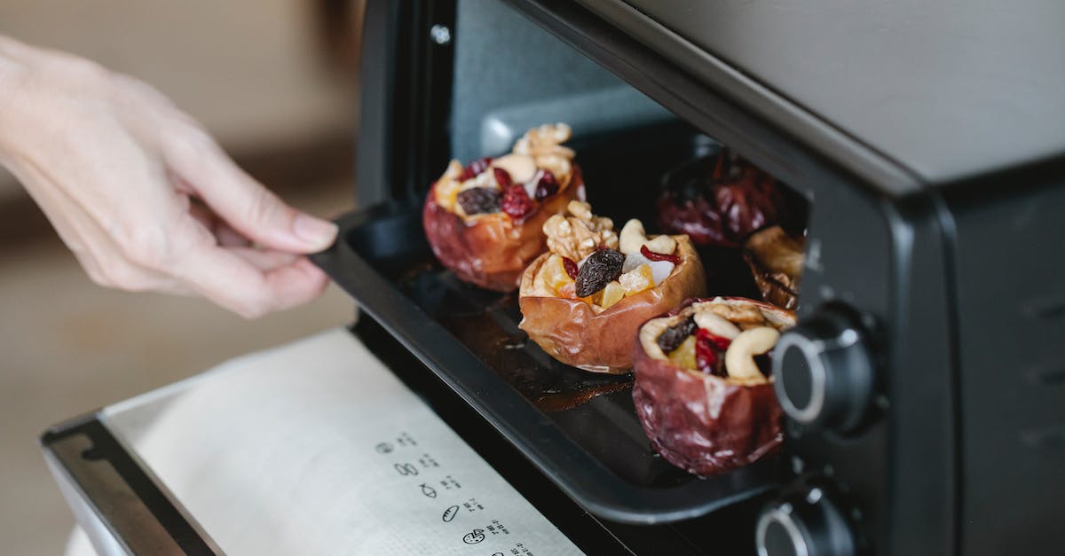 If I run out of one type of seeds for a given crop in Dwarf Fortress, can I alter the plot to fill it out? - Faceless cook getting out baking tray with delicious filled baked apples of electric oven at home