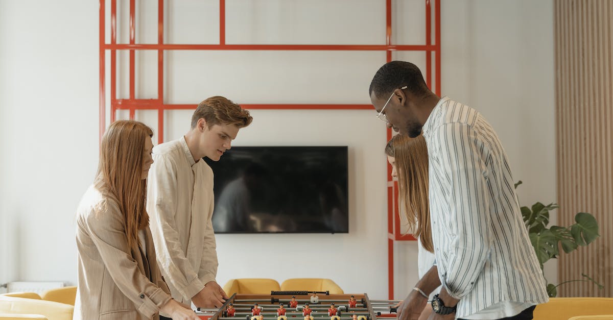 If no champions play, does the game last forever? - Man in White Dress Shirt Standing Beside Woman in White Long Sleeve Shirt