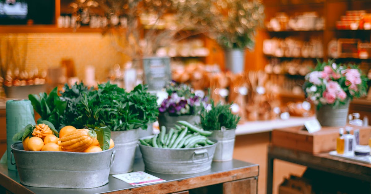 In Auctioneer, is there a way to set a default markup price when there is no competition? - Assorted fresh vegetables and herbs in iron containers on table in modern store