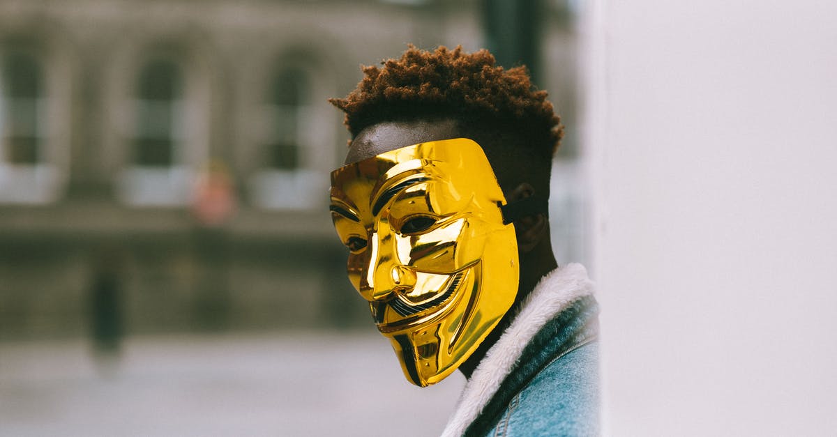 In Civilization 5, can I burn a city state which has joined Austria by marriage? - Black activist in golden Anonymous mask standing on city street