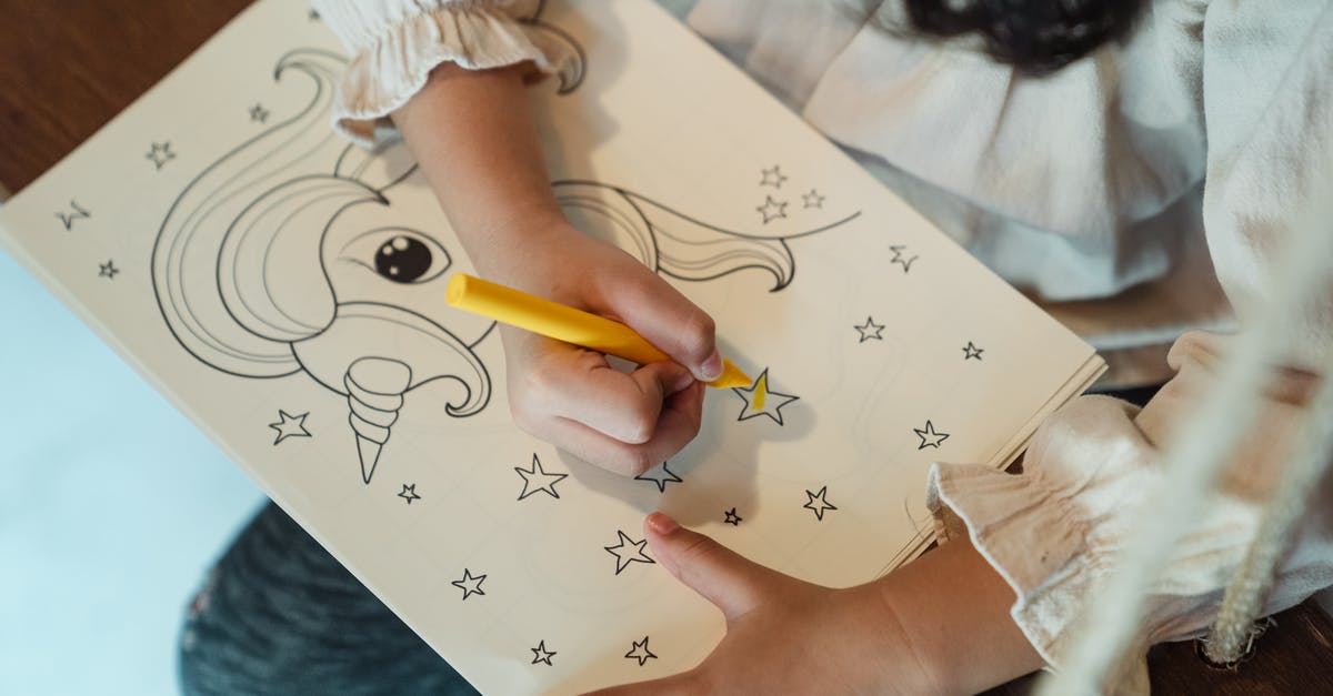 In Cut the Rope 2, what do I do after finding a hidden star in a video? - Crop anonymous girl painting drawing with felt pen at home