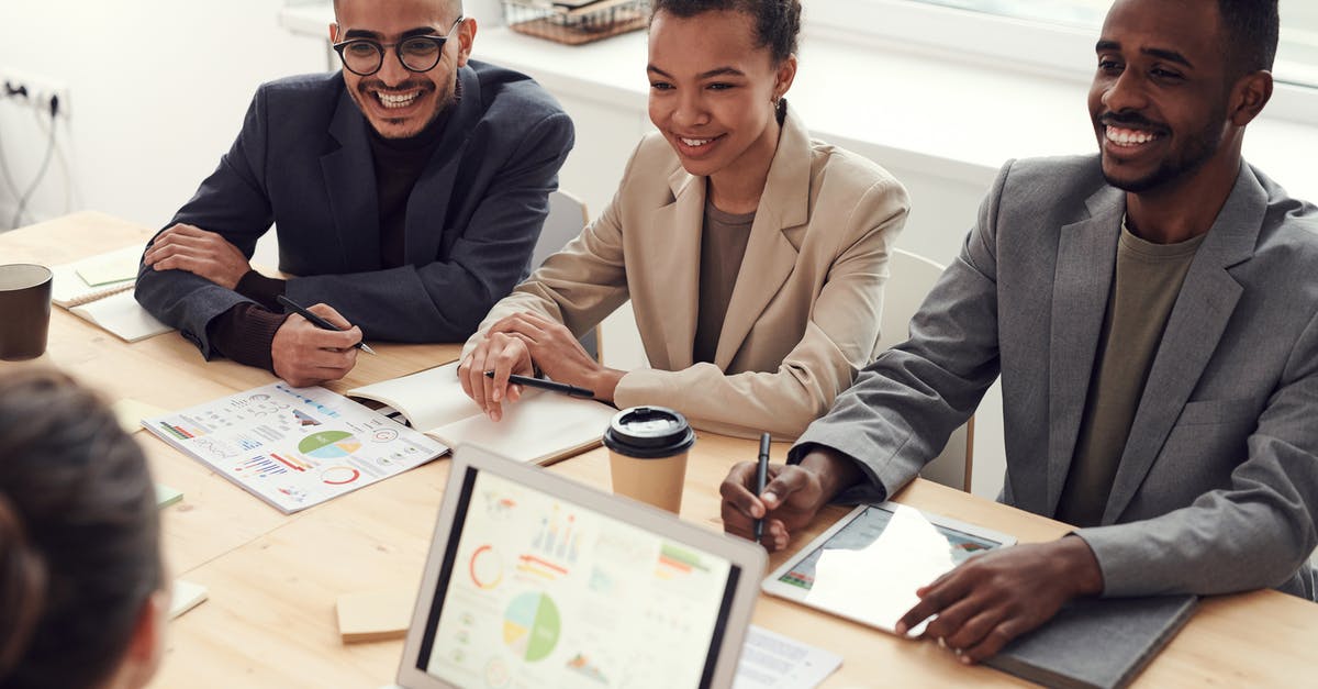 In discord, can I maintain a conversation with only one player while listening to the whole group? - Photo of Three People Smiling While Having a Meeting