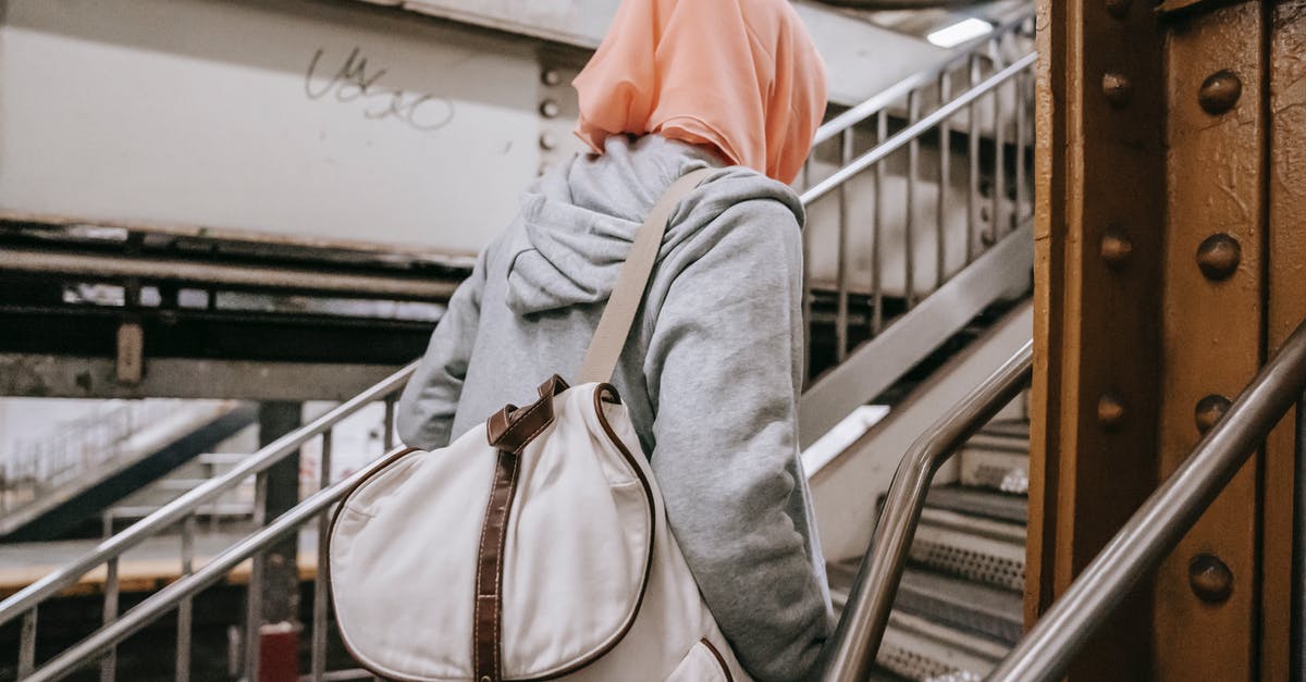 In fallout 4 is the East Boston Police Station Haunted? - Woman with backpack walking upstairs in underground